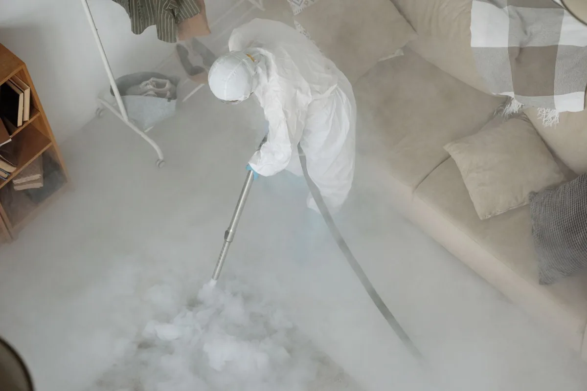 Biohazard cleanup technician in protective equipment, King Cove, AK